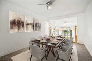 Open-concept dining area featuring a wood-finish dining table and carpeted flooring