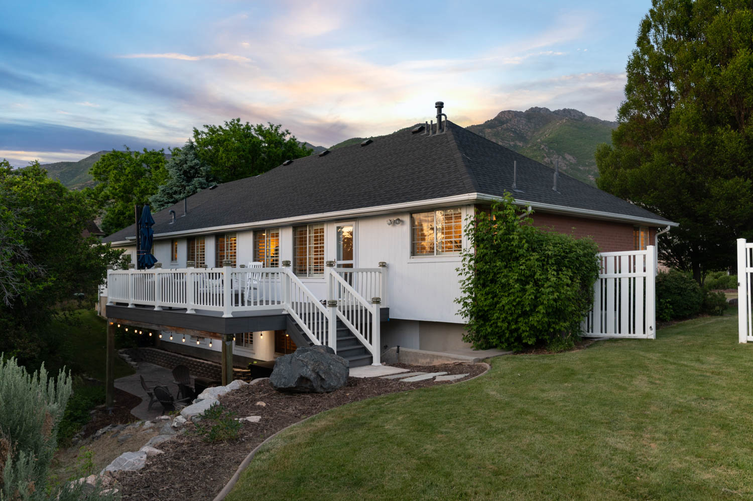 Multi-level deck with white railings and staircase