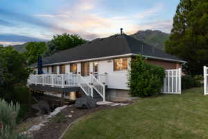 Multi-level deck with white railings and staircase
