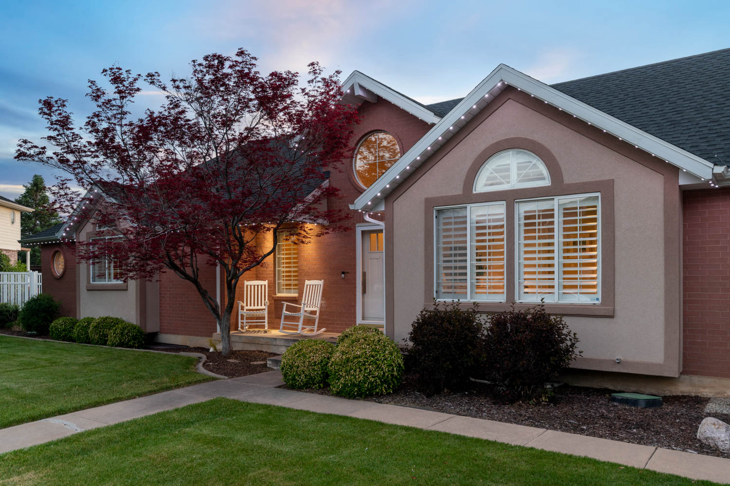 Property exterior featuring a combination of brick and stucco siding