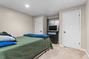 Neutral-toned walls complement the light-colored carpeting