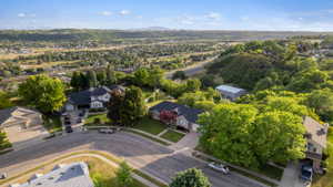 Residential street featuring a cul-de-sac and multiple single-family homes