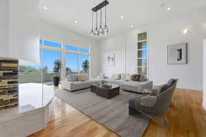 Open-concept living space with high ceilings and wood-finish flooring