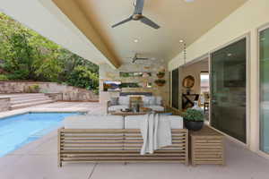 Covered patio featuring recessed lighting and ceiling fans