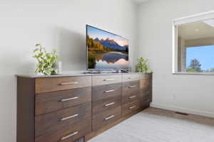 Custom built-in wood cabinetry featuring multiple drawers and a light-toned countertop