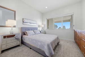 Bright room featuring a wide window, recessed lighting, and light-toned flooring