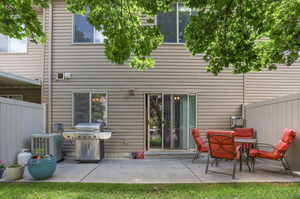 Rear exterior featuring beige horizontal siding