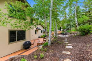 Terraced wood-finish deck with built-in bench seating