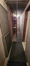 Concrete wall construction with exposed ceiling joists