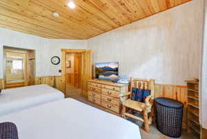 Wood-paneled ceiling with recessed lighting