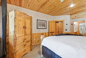 Wood-paneled ceiling with recessed lighting