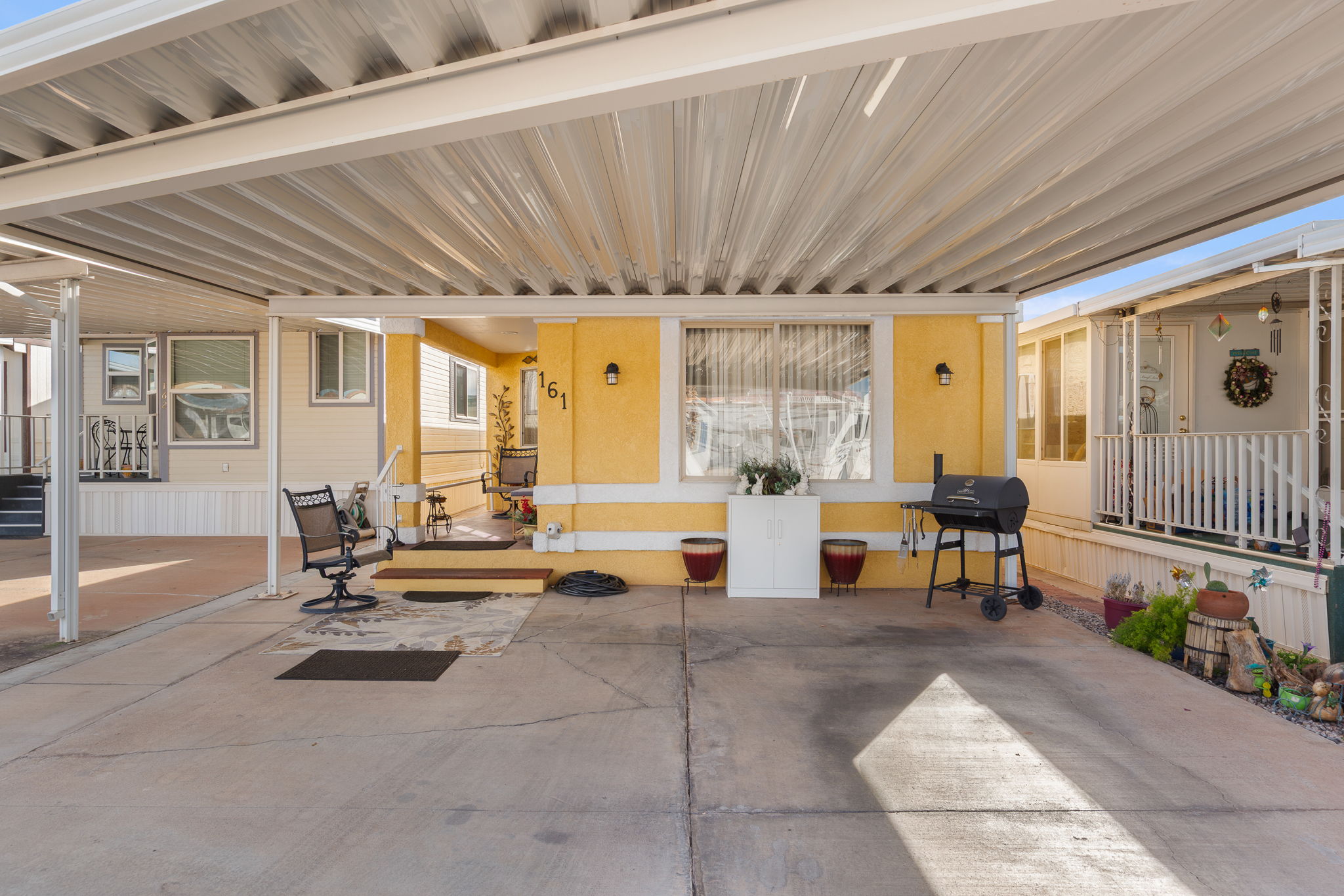 Covered concrete carport with ample space
