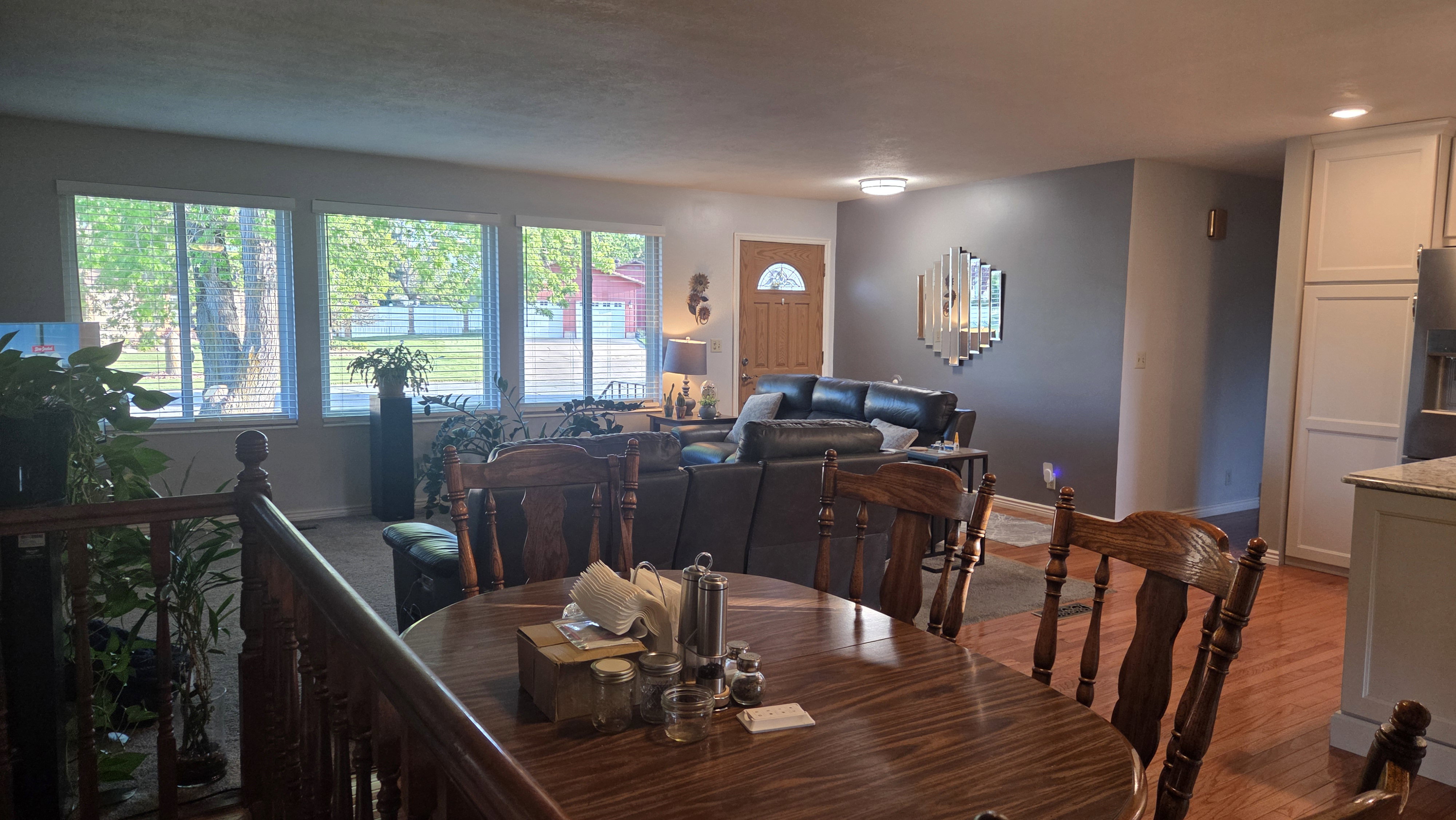 Hardwood flooring throughout the dining area, featuring an open concept to the living space