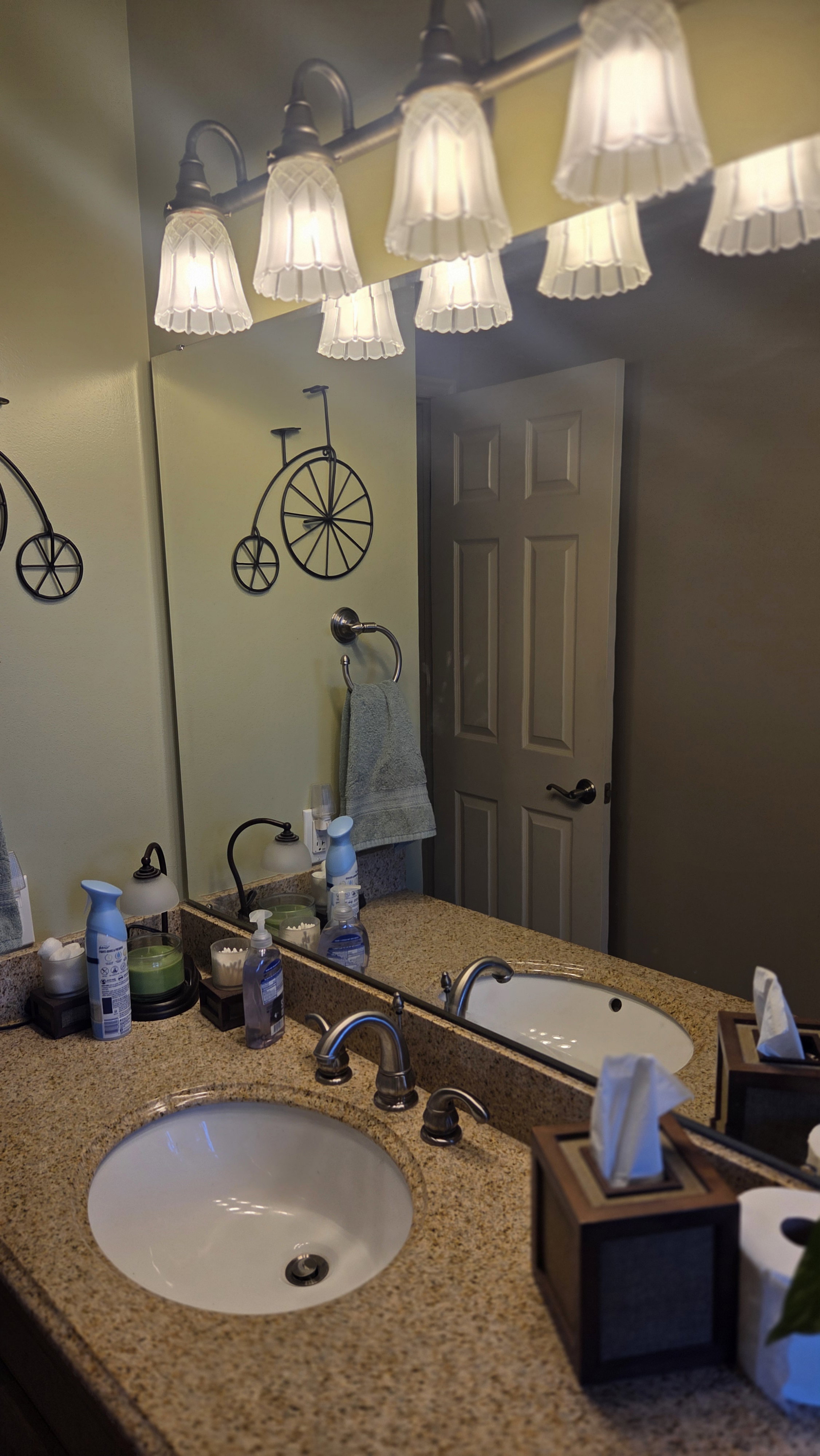 Dual vanity with undermount sinks and a speckled stone countertop