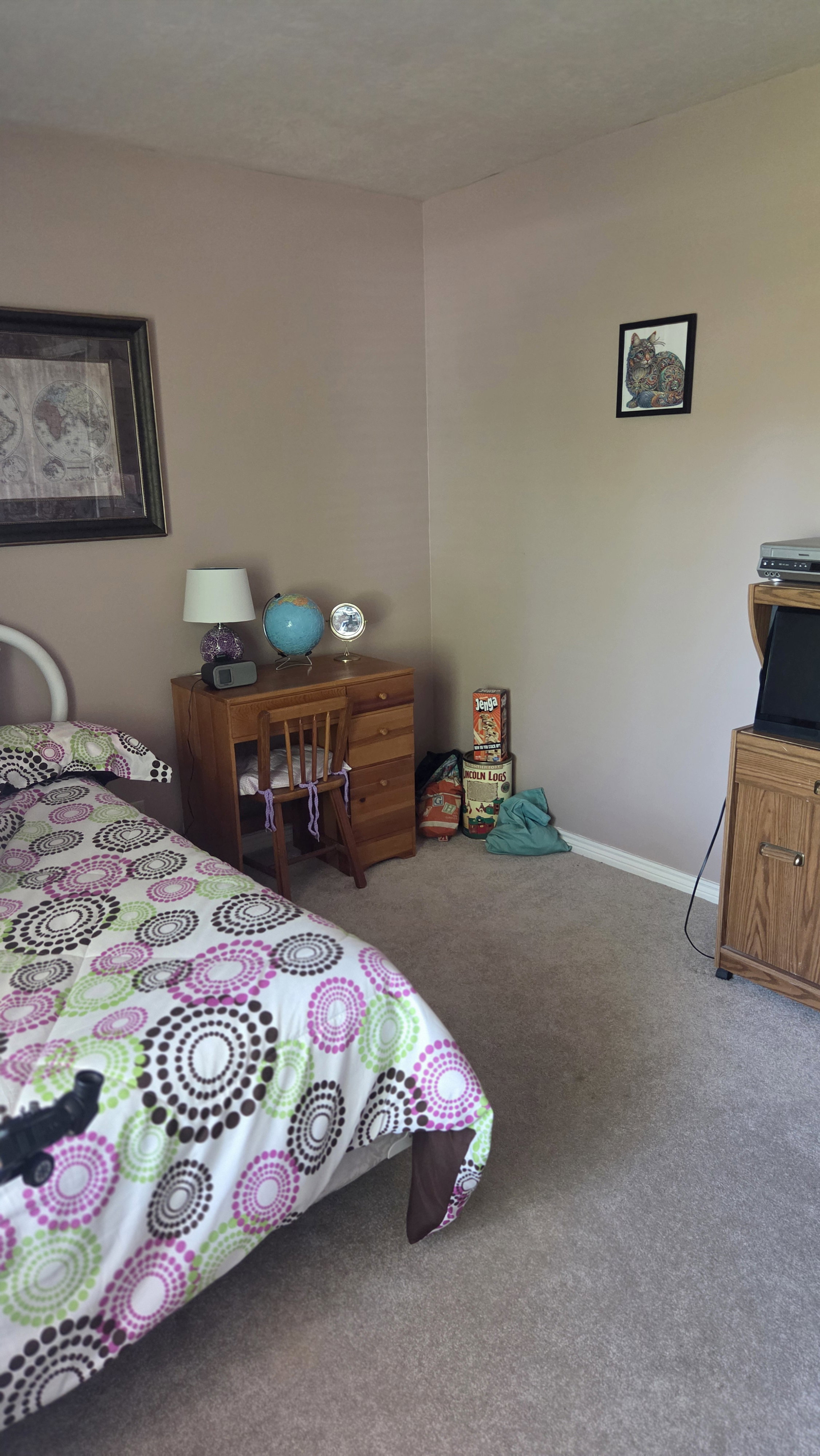 Carpeted room featuring neutral wall tones and white baseboards