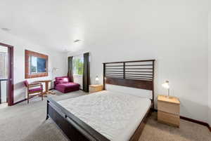 Spacious room featuring neutral carpeting and white walls
