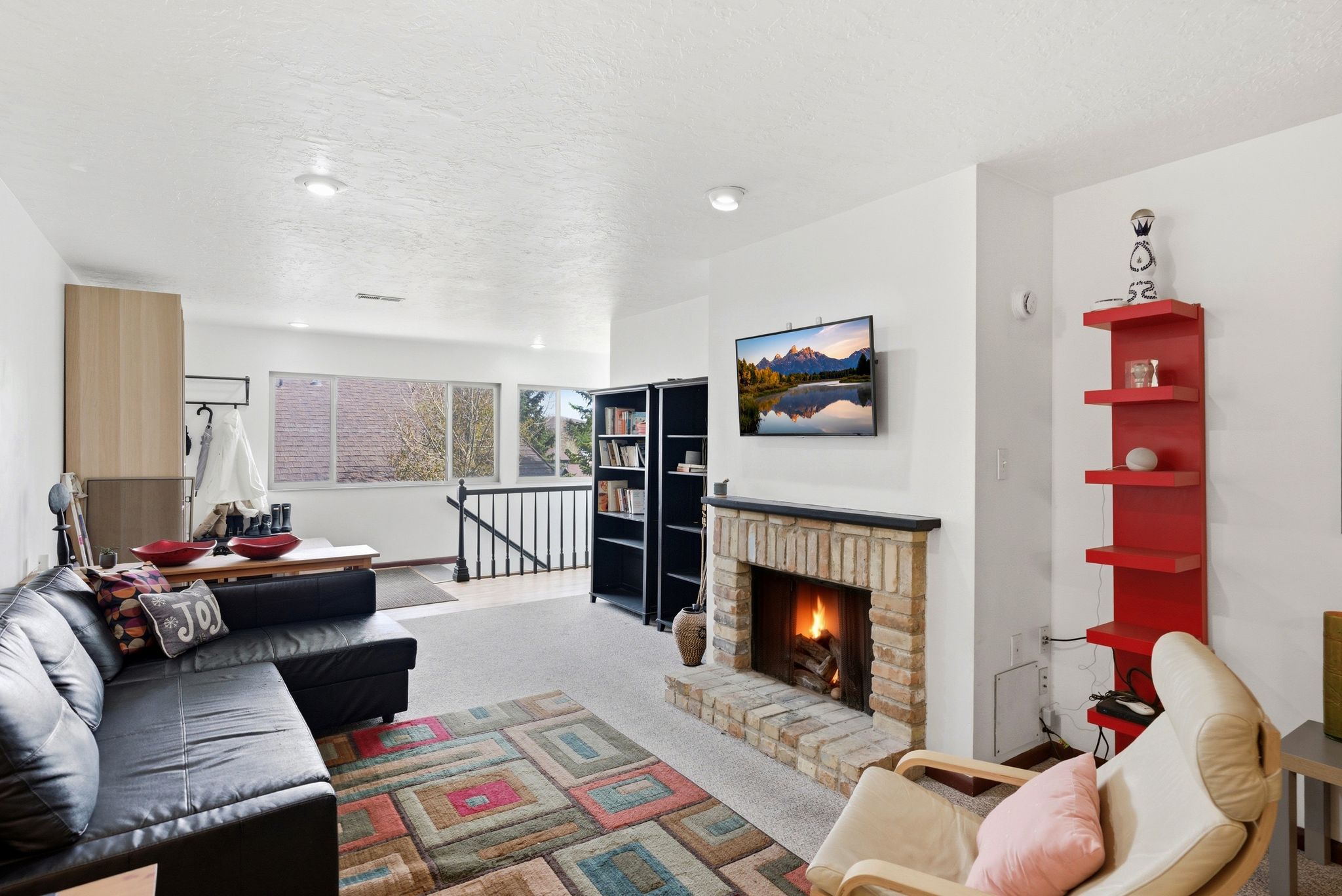 Brick-surround fireplace with a dark mantel
