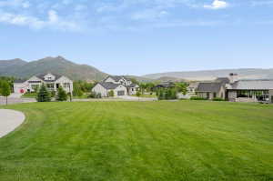 Expansive green lawn with mountain backdrop