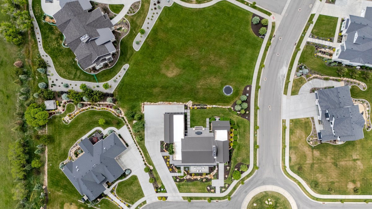 Contemporary aerial rendering showcasing a residential neighborhood with paved streets