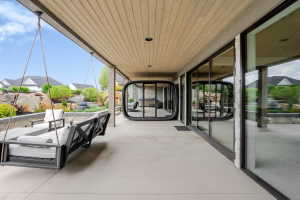 Covered outdoor patio featuring a wood-finish plank ceiling and recessed lighting