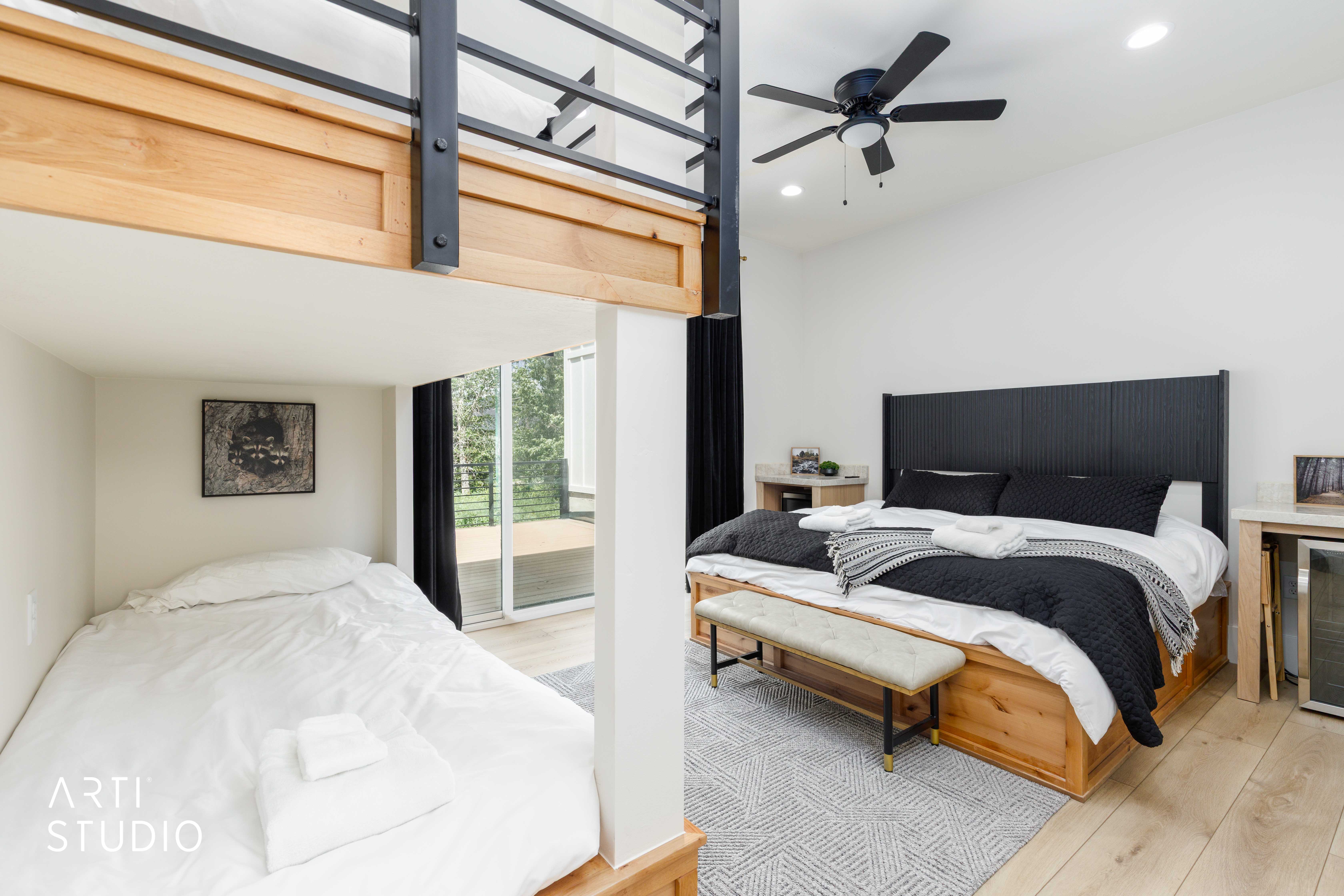 Bedroom featuring a wood-finish floor and white walls