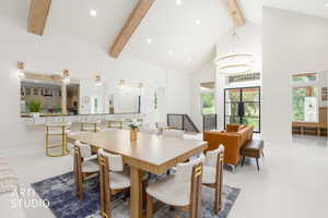 Vaulted ceilings with exposed wood beams define this open-concept living space