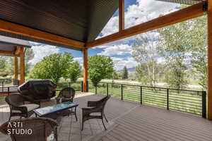 Expansive covered deck featuring wood-finish composite decking