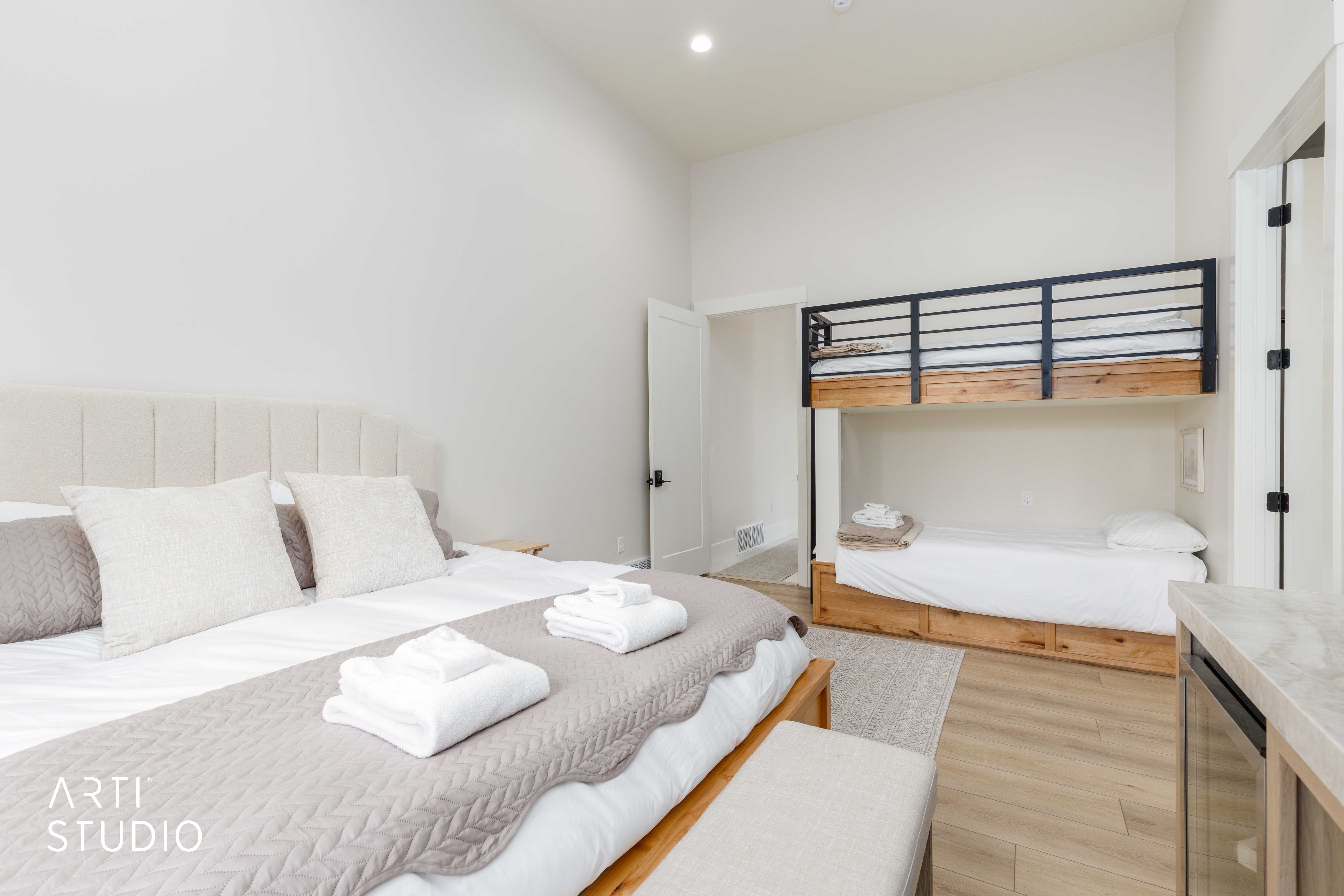 Bedroom featuring vaulted ceilings and light wood-finish flooring