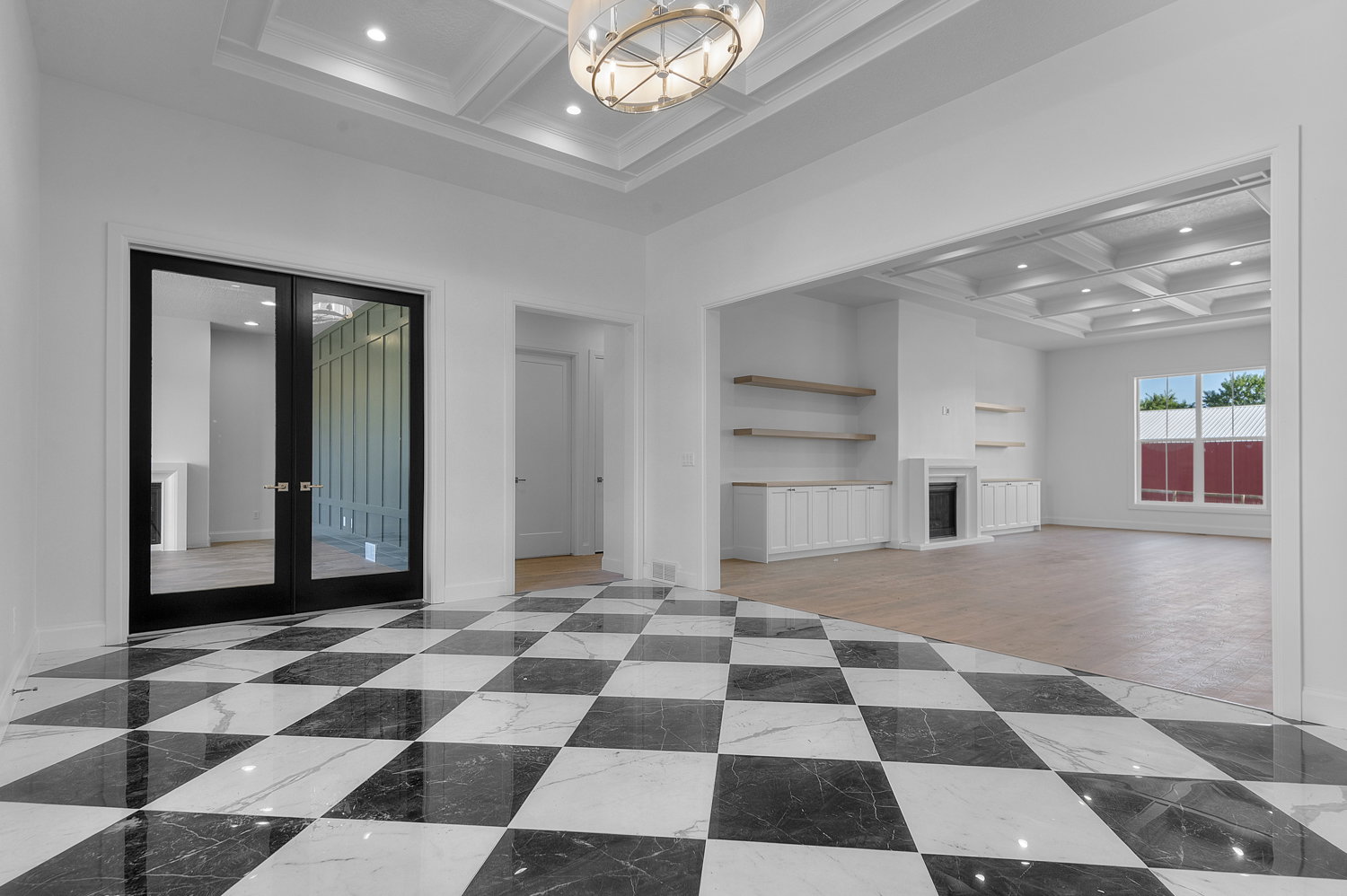 Entry foyer featuring black and white checkerboard tile flooring