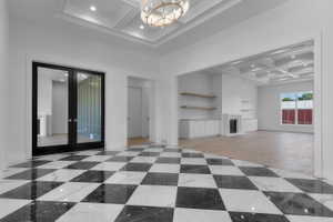 Entry foyer featuring black and white checkerboard tile flooring