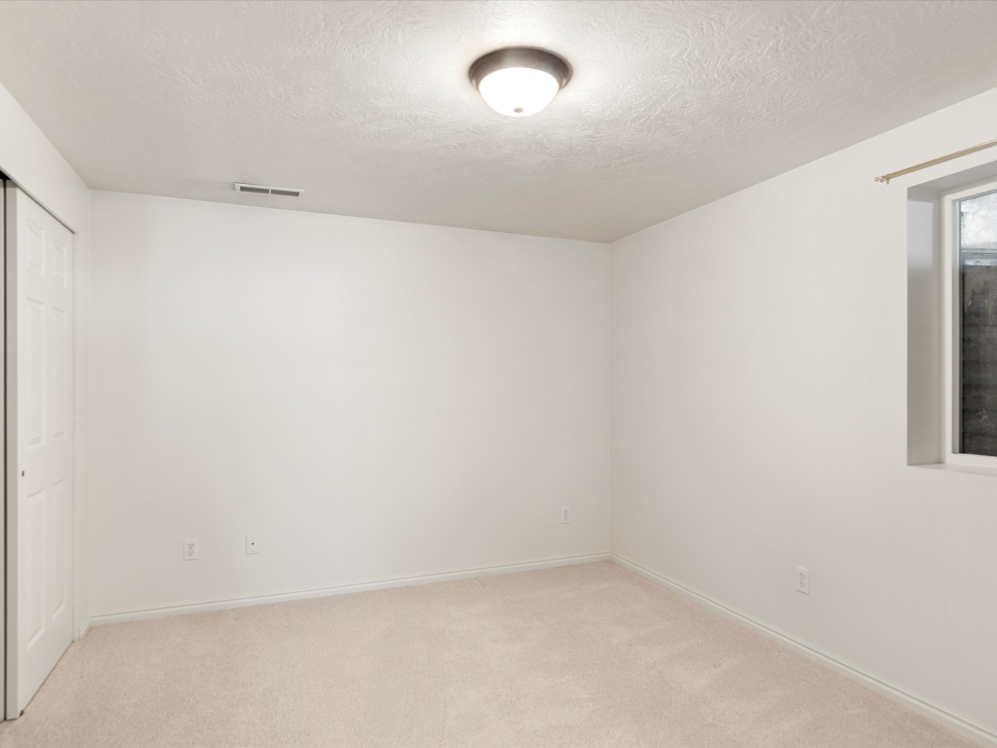 Neutral wall colors with light-toned carpeting