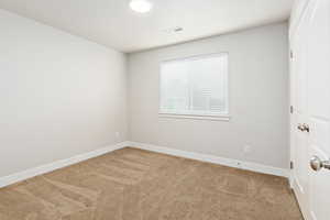 Neutral tone wall paint with a window featuring horizontal blinds