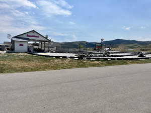Go-kart track featuring a paved surface and tire barriers