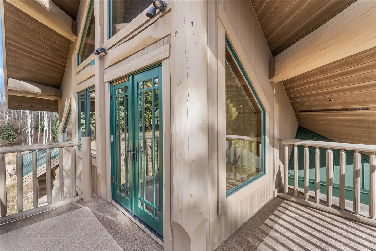Exterior balcony with a textured stone-finish floor