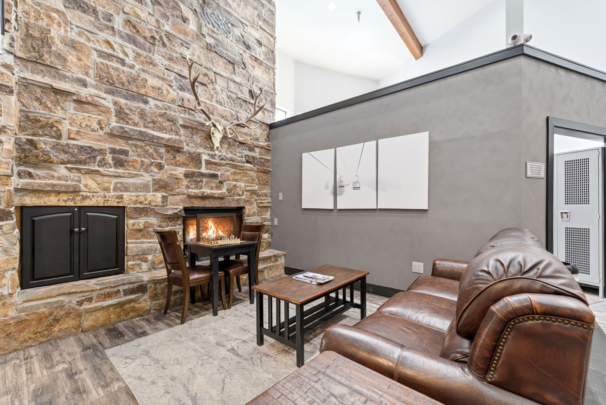 Stone-faced fireplace with a hearth and a secondary storage unit