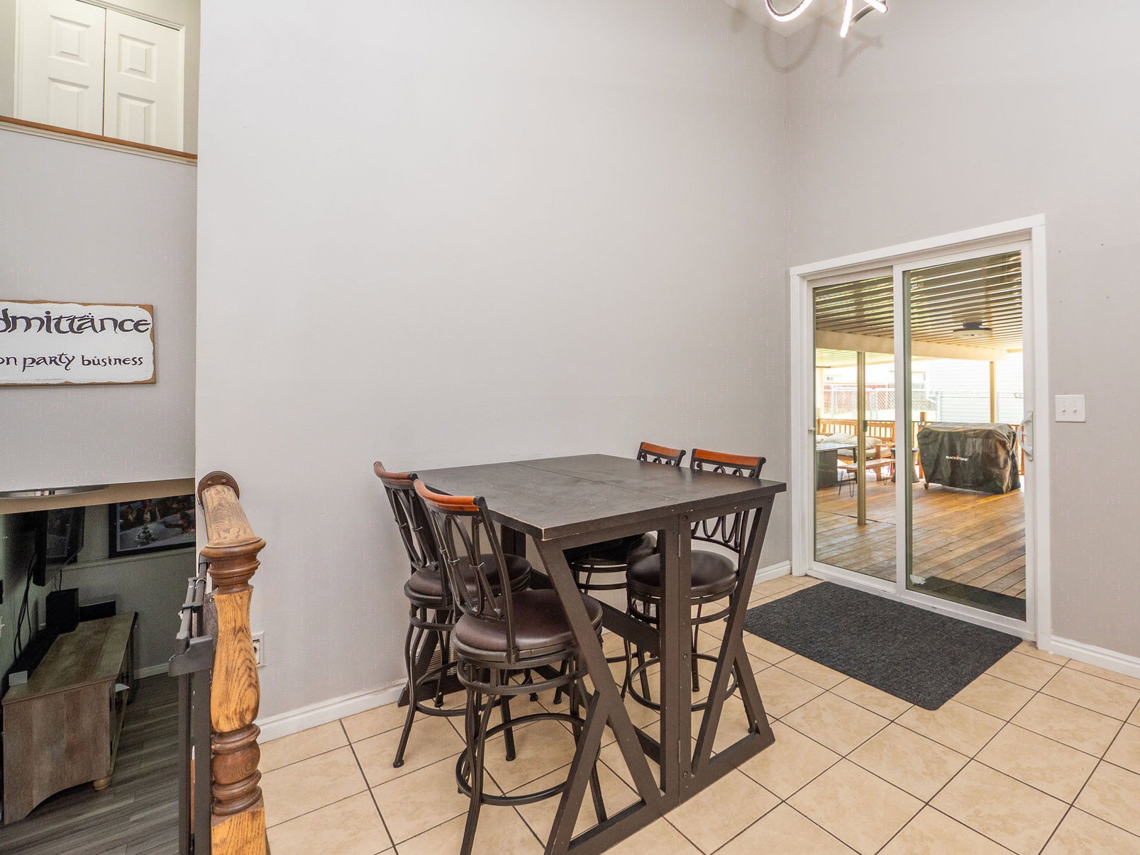 Dining room with new sliding glass door onto huge covered deck
