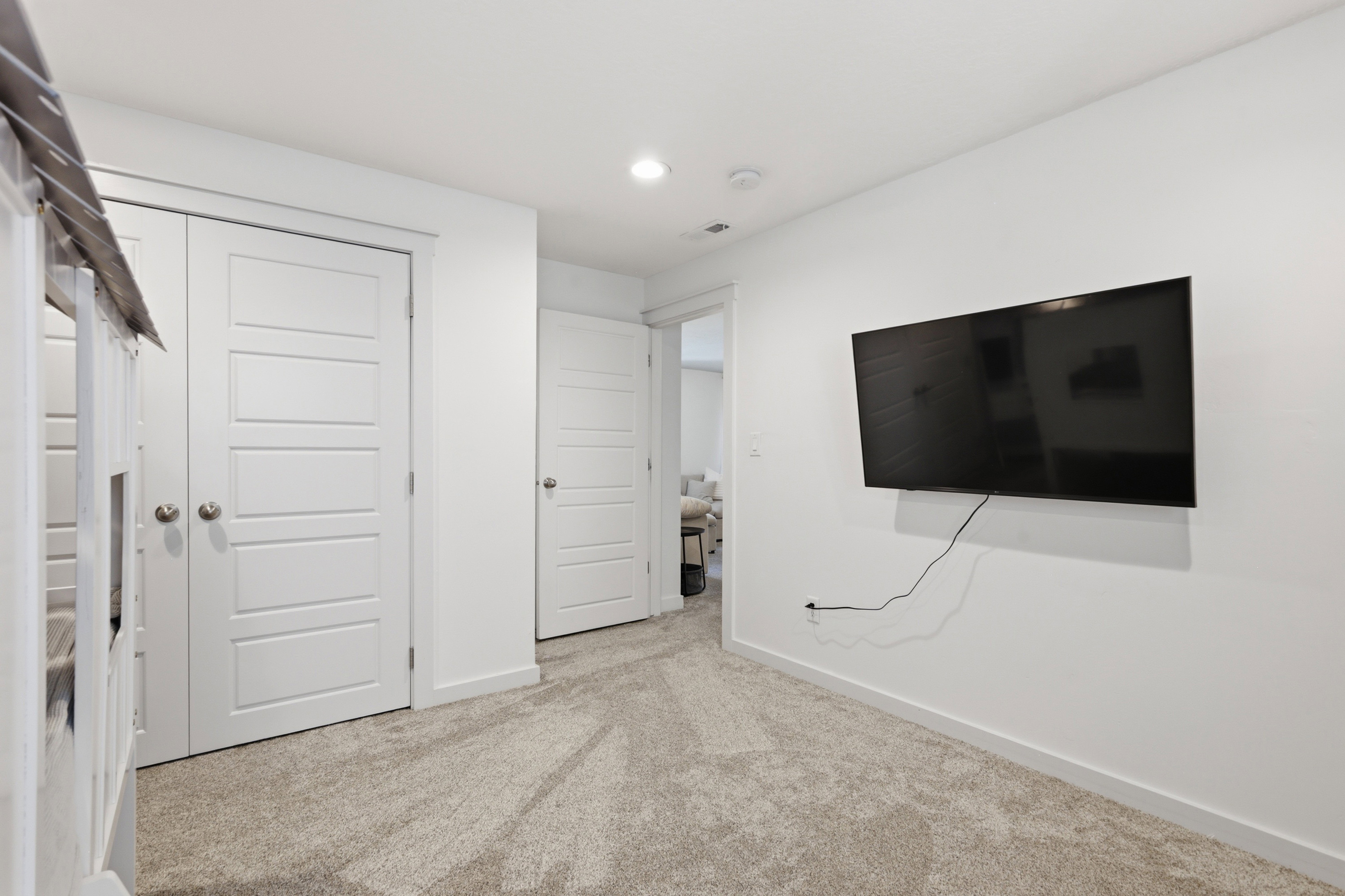 Neutral-toned carpeting paired with white walls