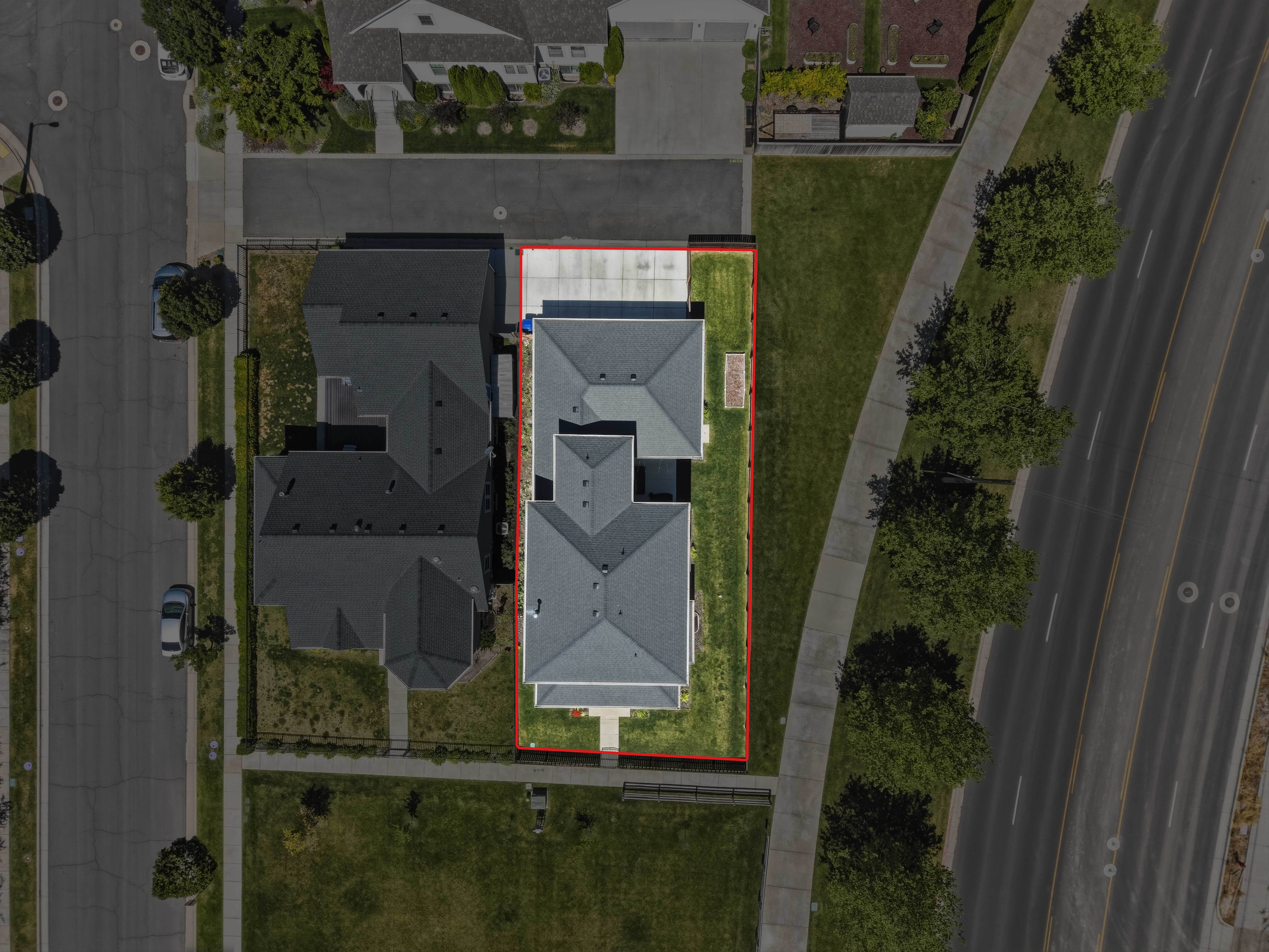 Aerial perspective showcasing a single-family residence with a multi-gabled roofline