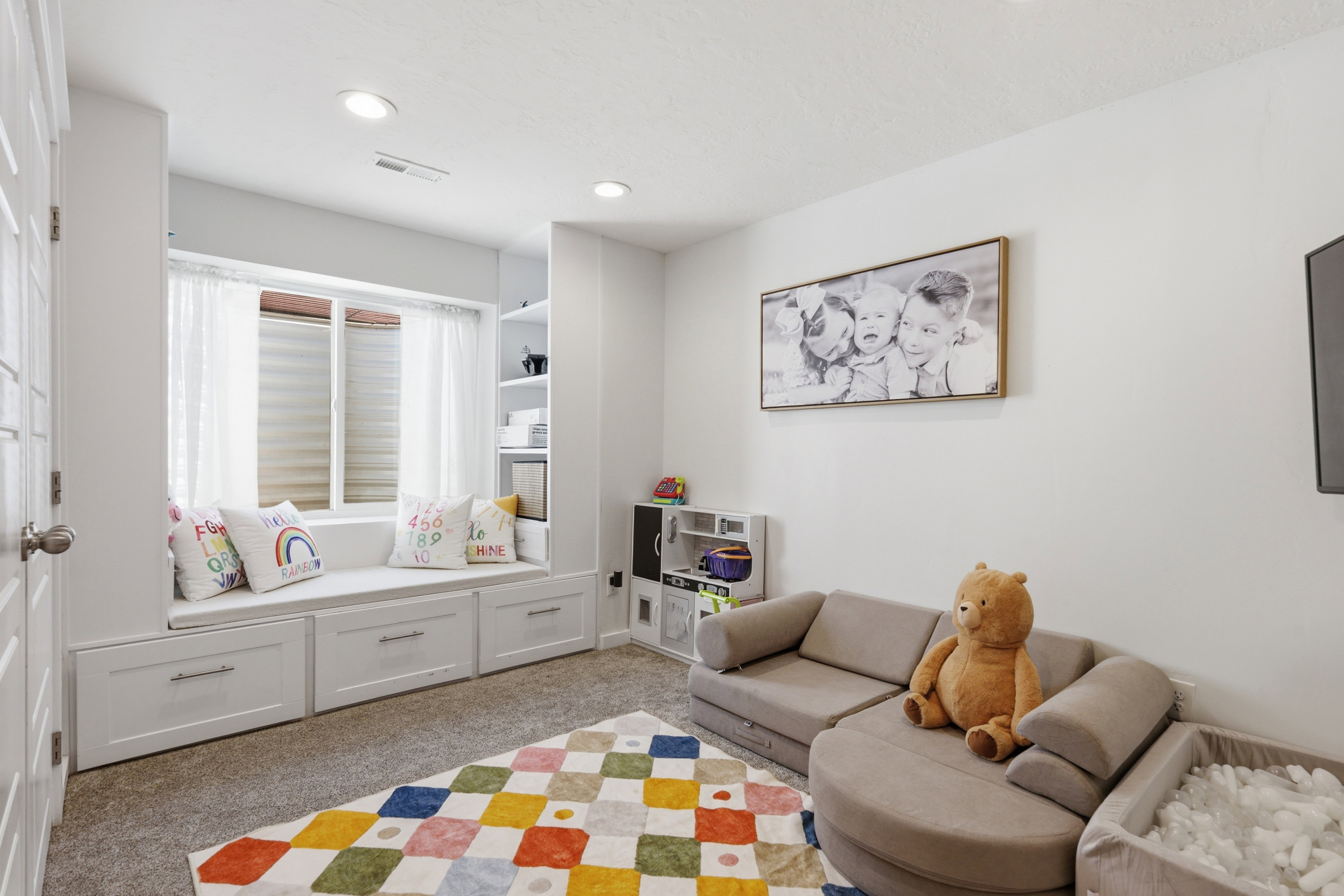 Integrated window seat with storage drawers and built-in shelving