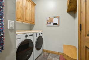 Laundry area featuring a side-by-side washer and dryer