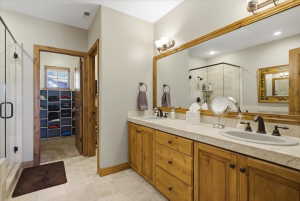 Master bathroom featuring a spacious closet