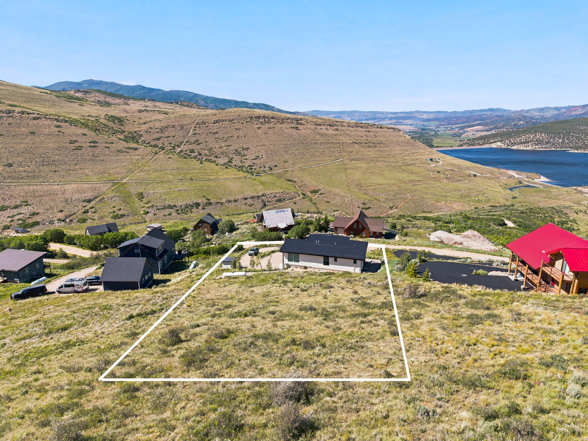 Expansive undeveloped lot featuring natural vegetation and prominent mountain scenery