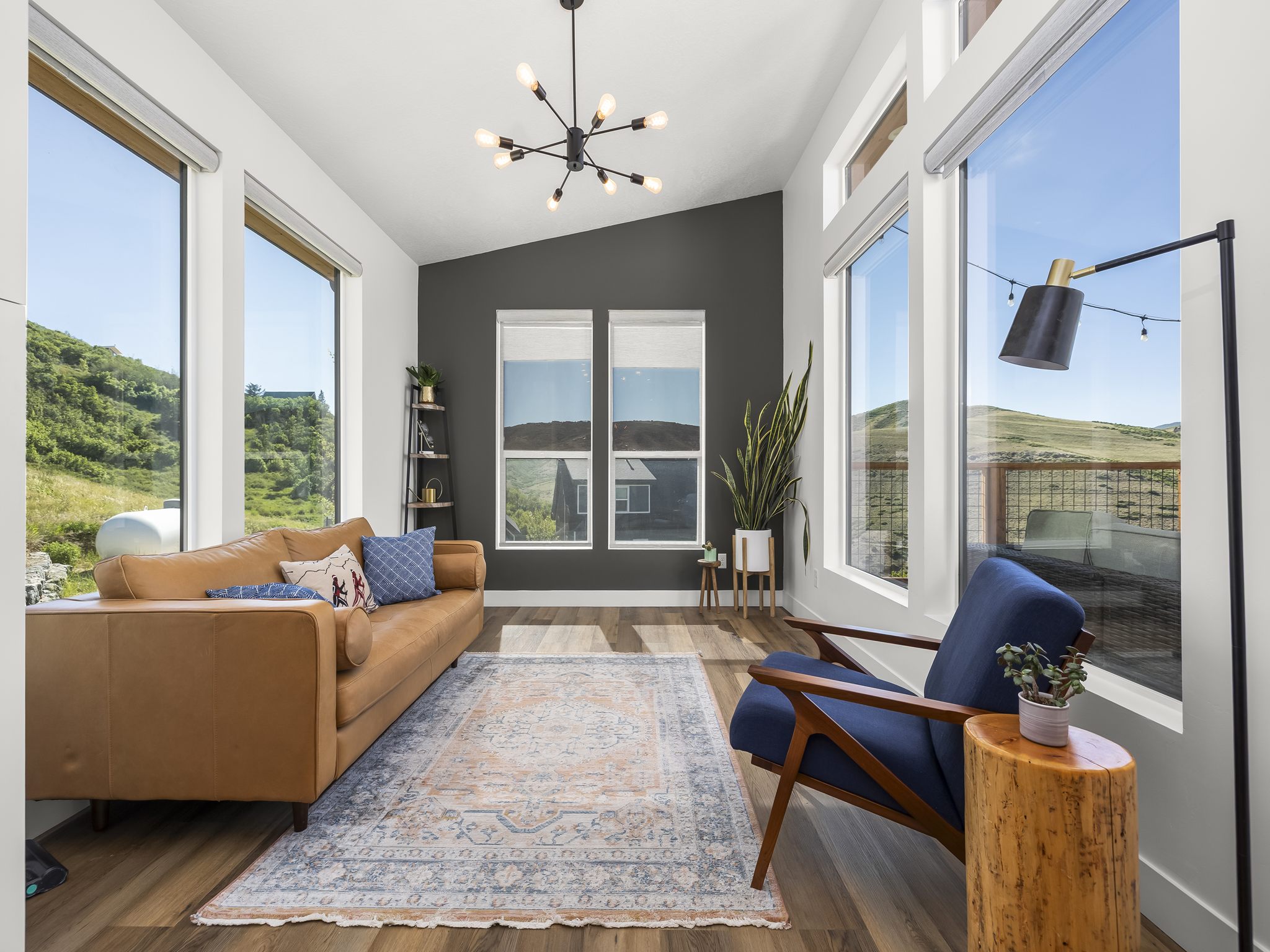 Vaulted ceiling great room with wood-finish flooring