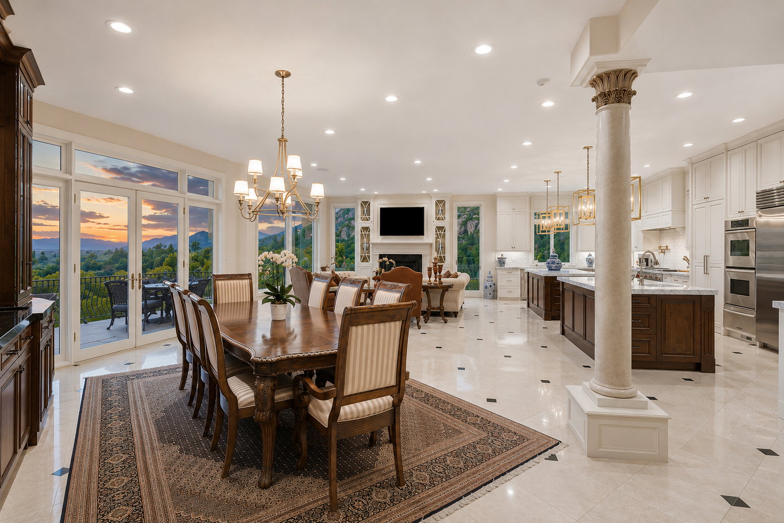 Spacious open-concept interior featuring light-toned flooring with dark accent tiles, French doors opening to an outdoor patio, a formal dining area with a brass chandelier, a gourmet kitchen with stainless steel appliances, and a classical column detail