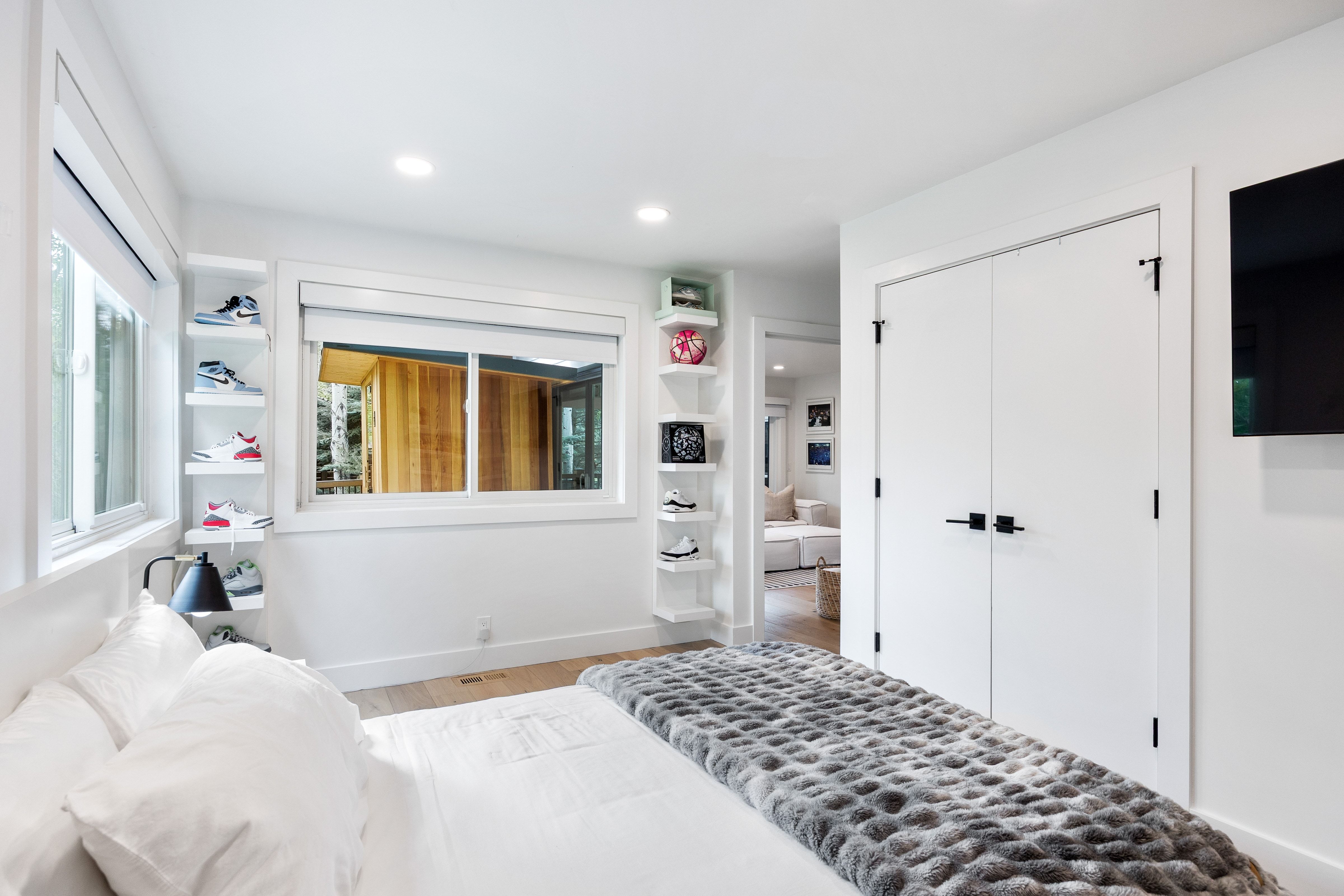 Bedroom featuring light wood-finish flooring, recessed lighting, and white walls