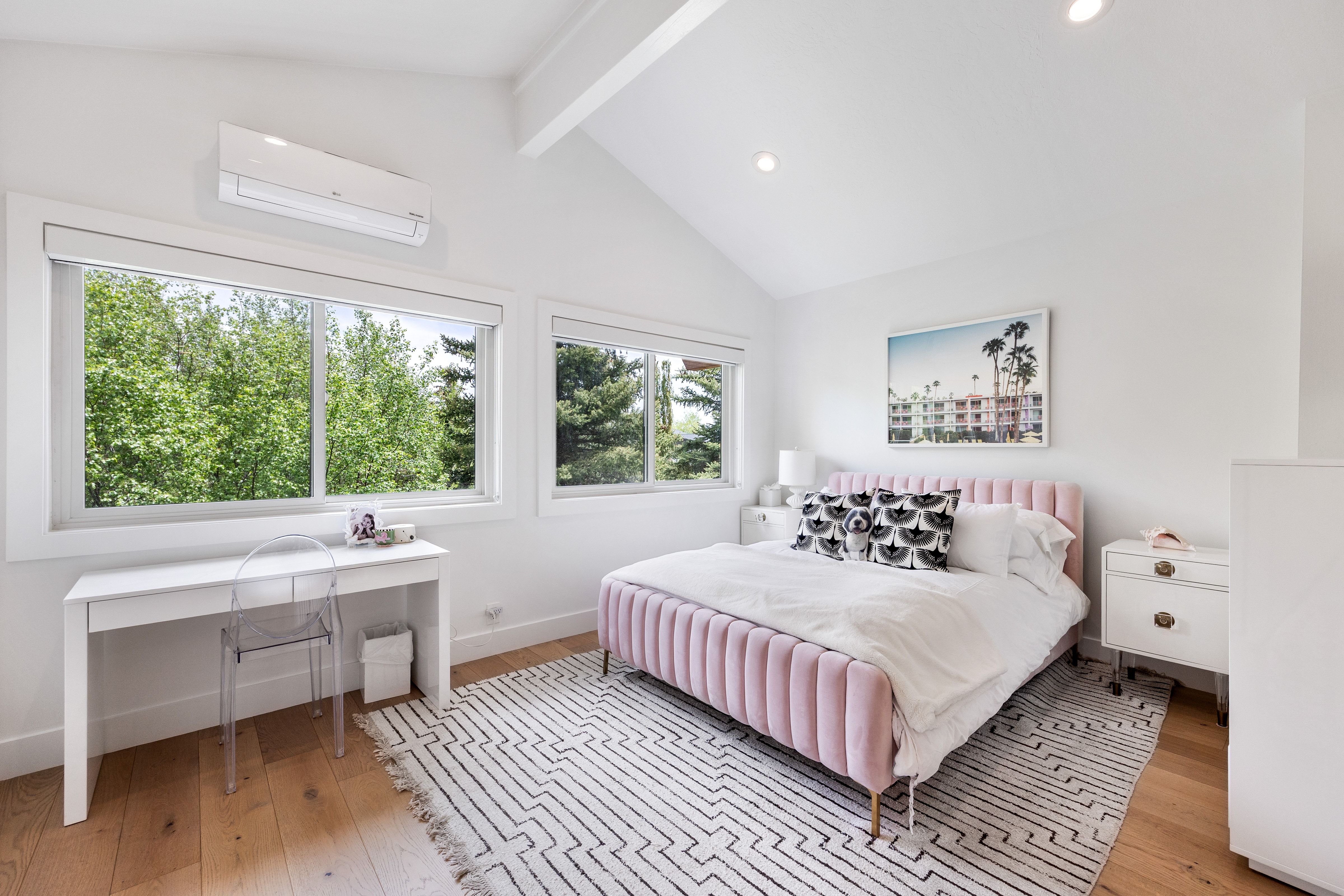 Bedroom featuring vaulted ceilings with exposed beams, wood-finish flooring, recessed lighting, and multiple windows