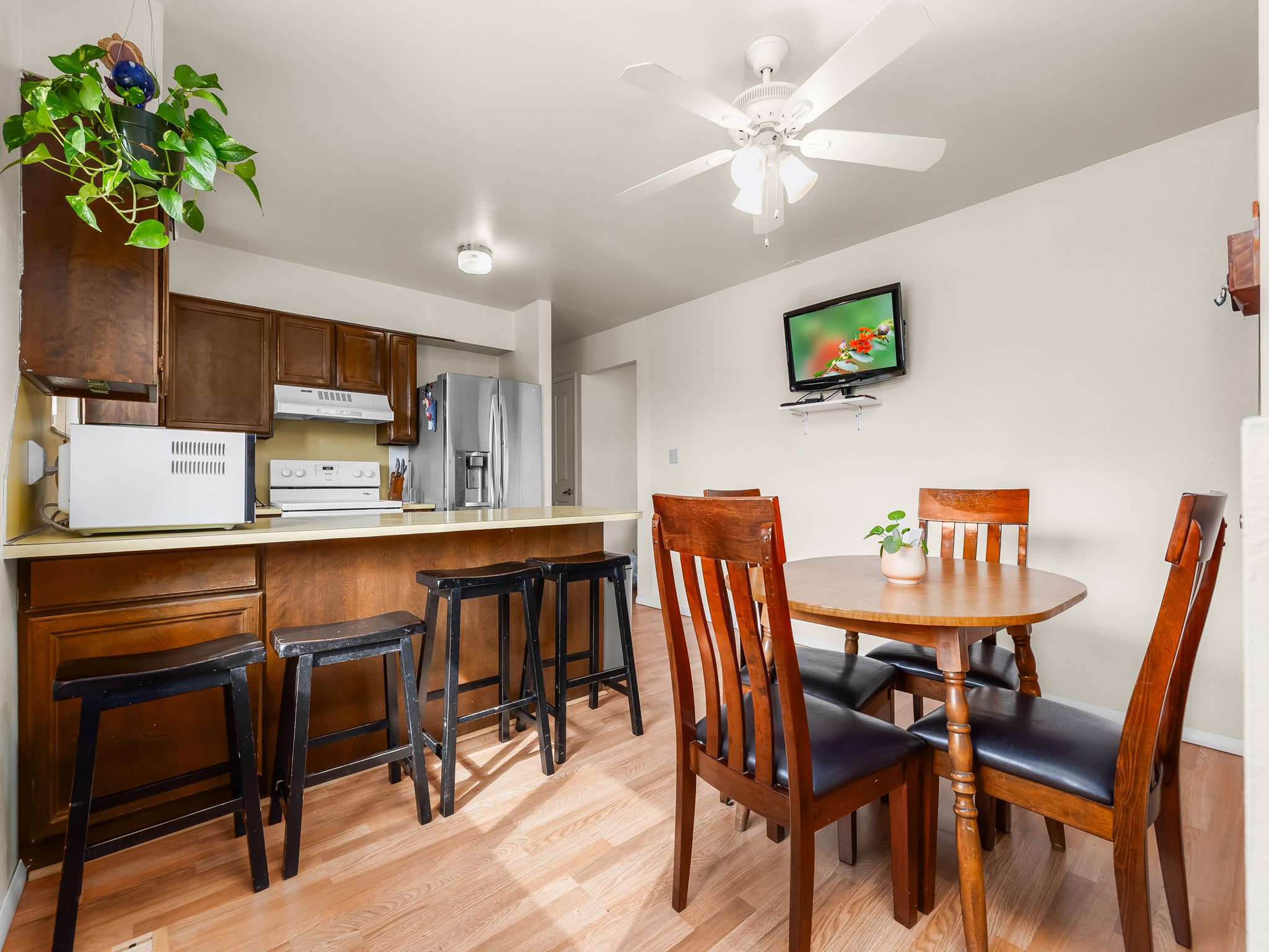 Kitchen and dining area featuring wood-finish flooring