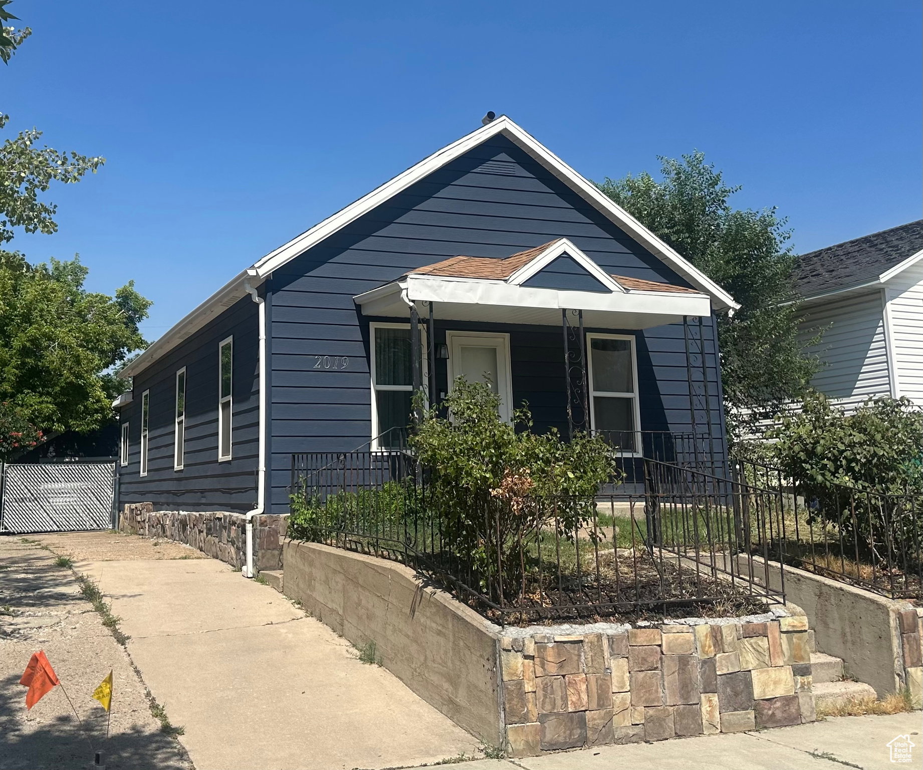 Blue horizontal siding exterior with white trim and a contrasting brown roof