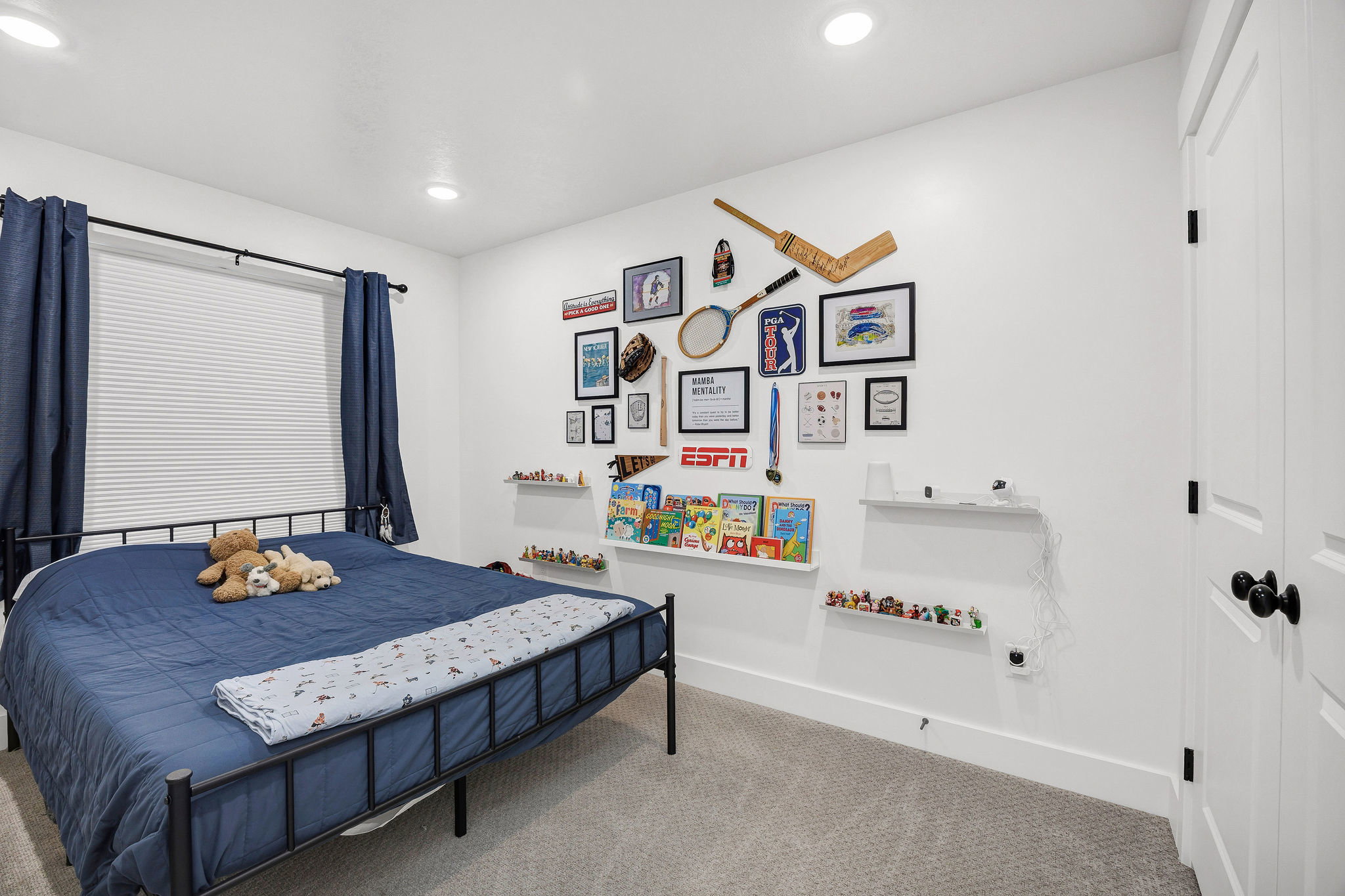 Bright interior space featuring white walls and light gray carpet