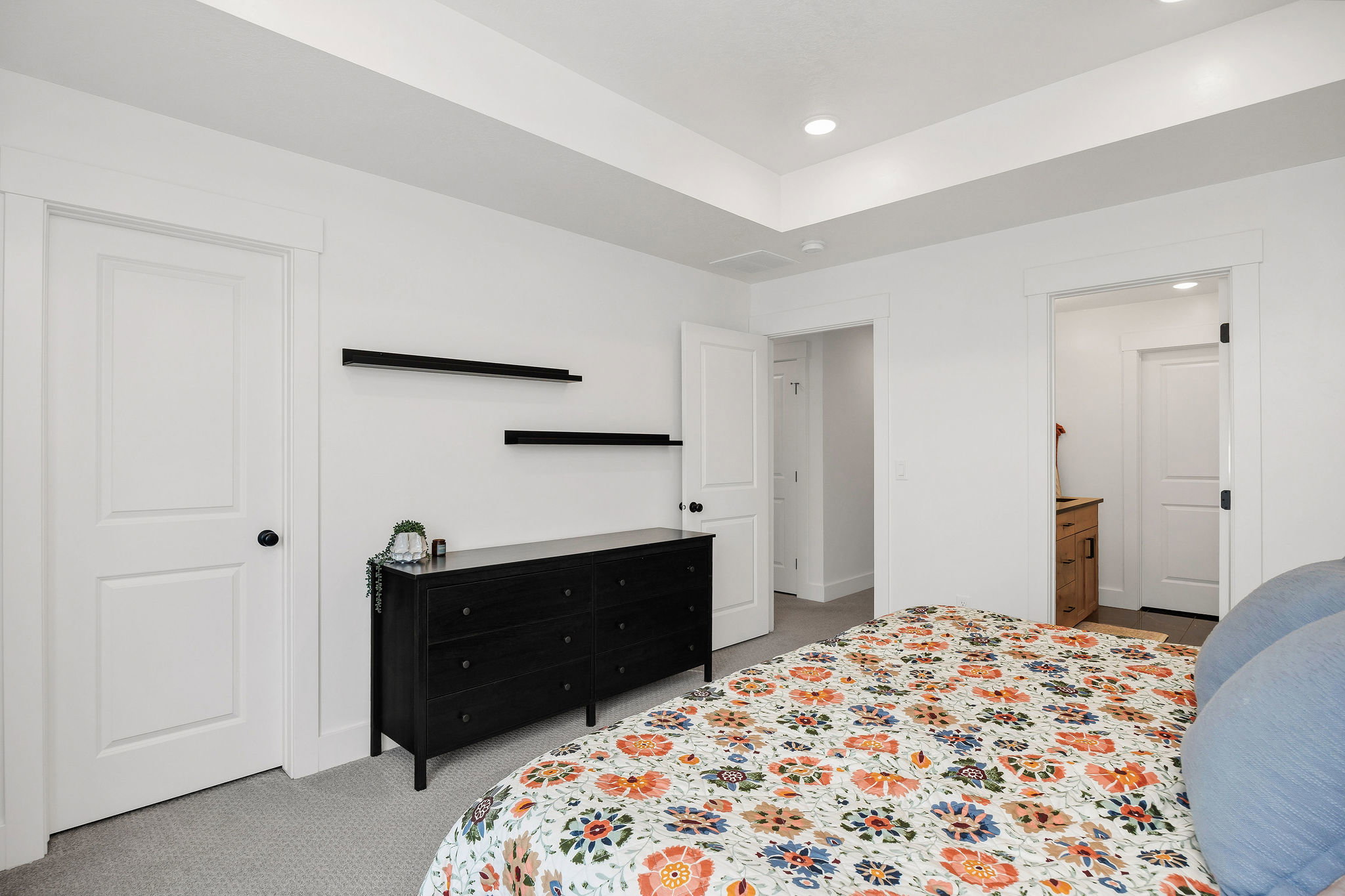 Recessed lighting illuminates a neutral palette interior